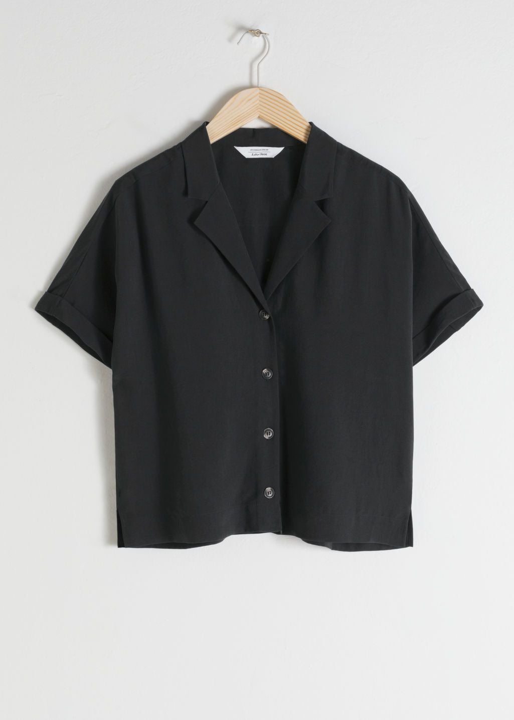 short sleeve black button top